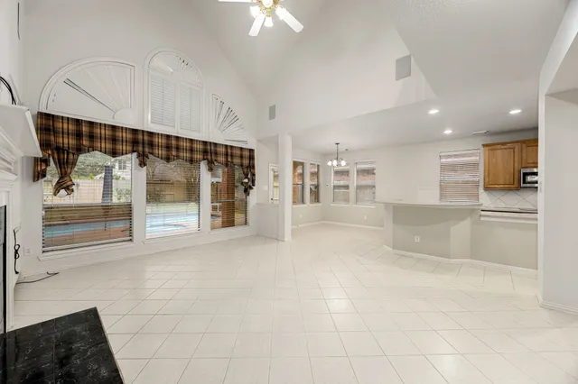 a view of an empty room with a fireplace