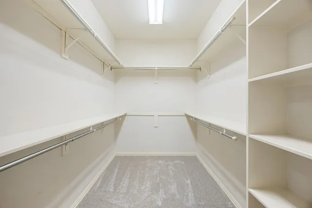 a view of an empty walk in closet