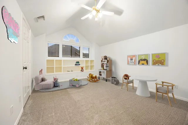 a bed room with furniture and a chandelier