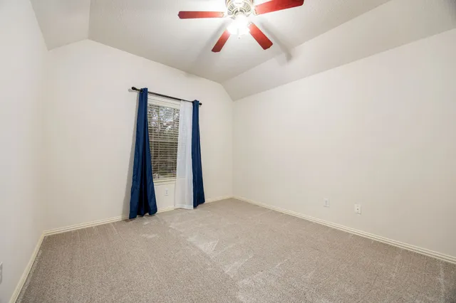 a view of a hallway with a large window