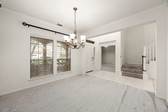 a view of an empty room with a balcony