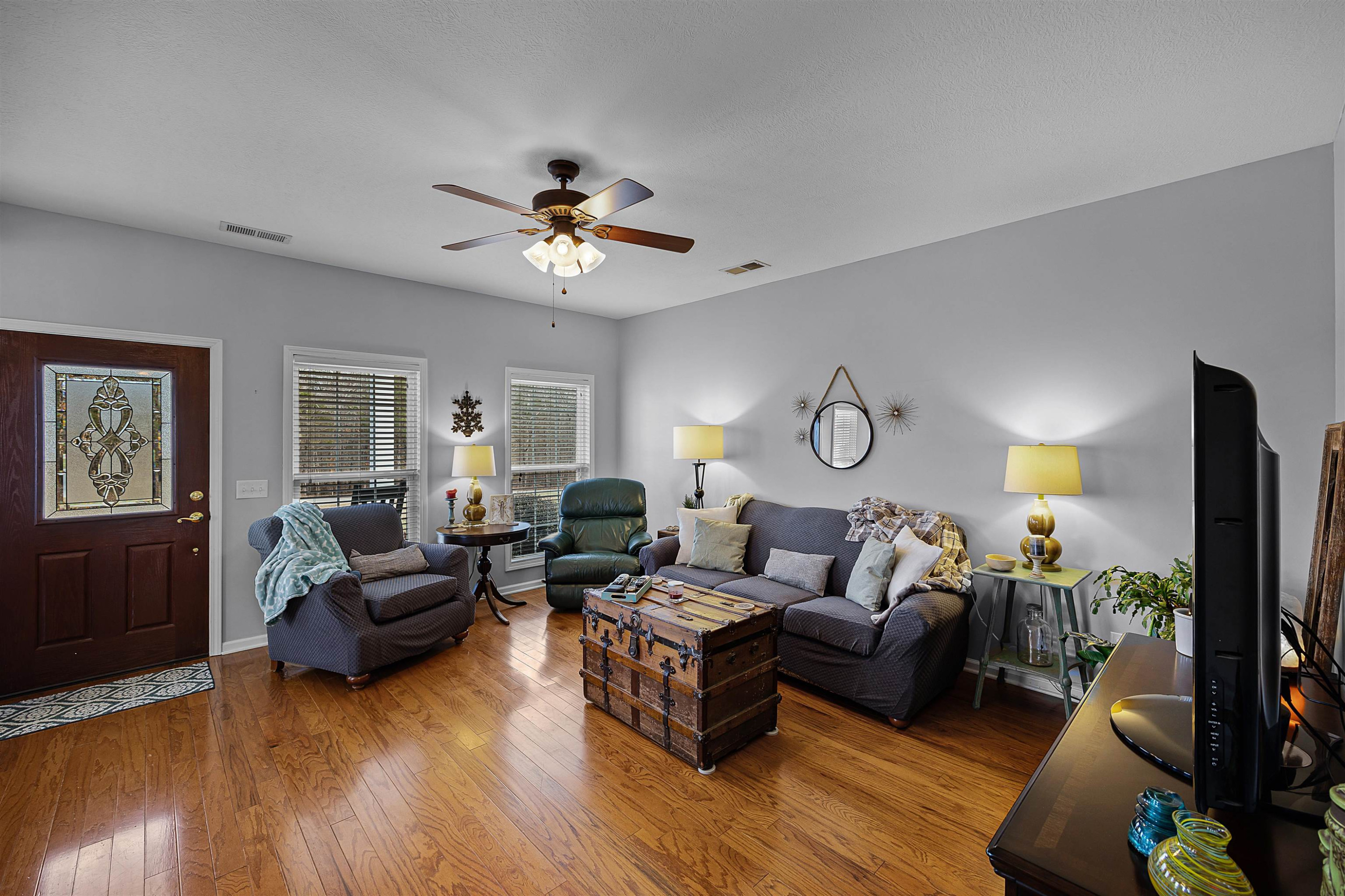 2305 Mockingbird Road Medon, TN 38356 - Photo 12 of 27 a living room with furniture a ceiling fan a lamp and a window