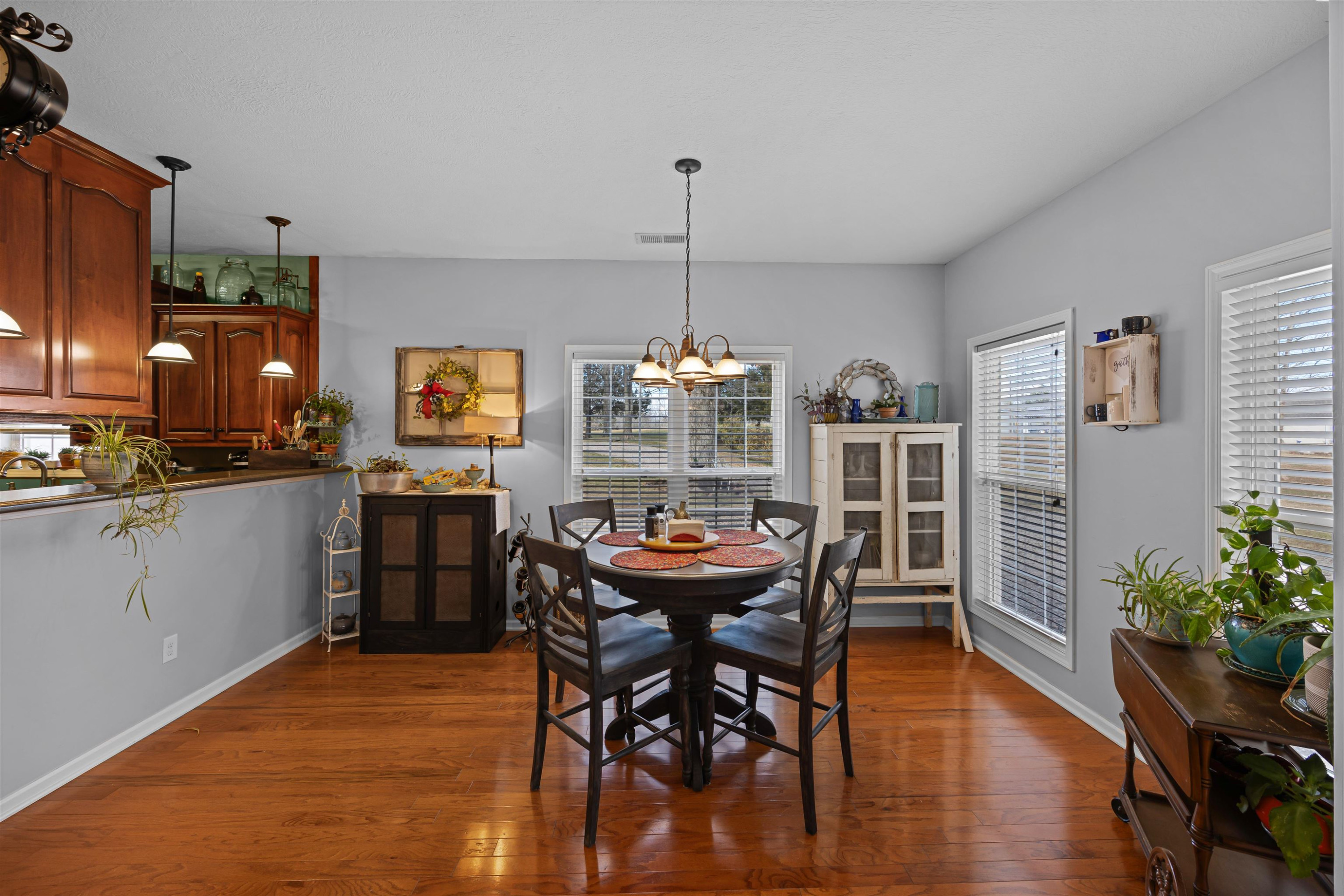 2305 Mockingbird Road Medon, TN 38356 - Photo 13 of 27 a dining room filled chandelier and wooden floor