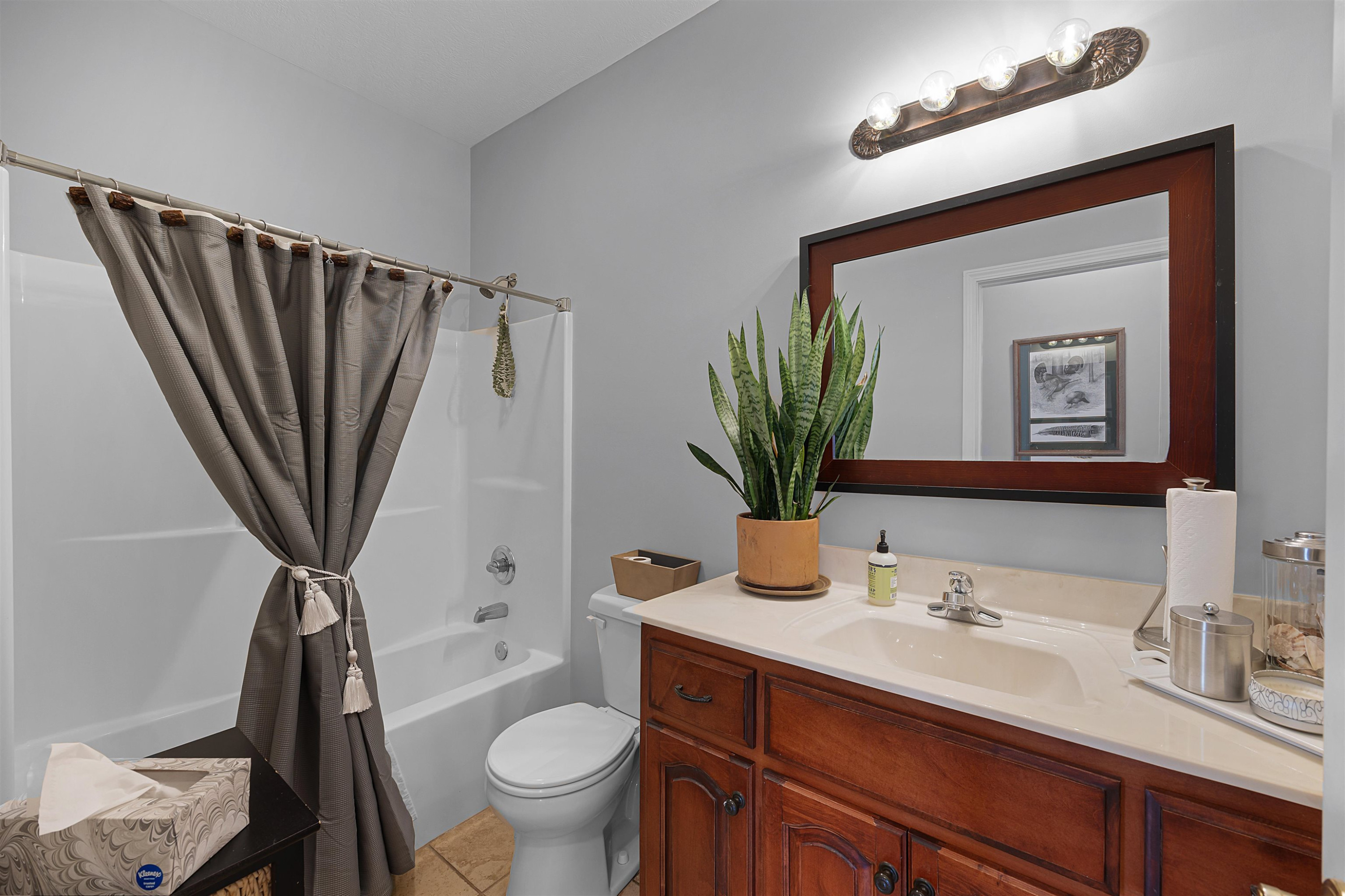 2305 Mockingbird Road Medon, TN 38356 - Photo 15 of 27 a bathroom with a sink a toilet a mirror and shower