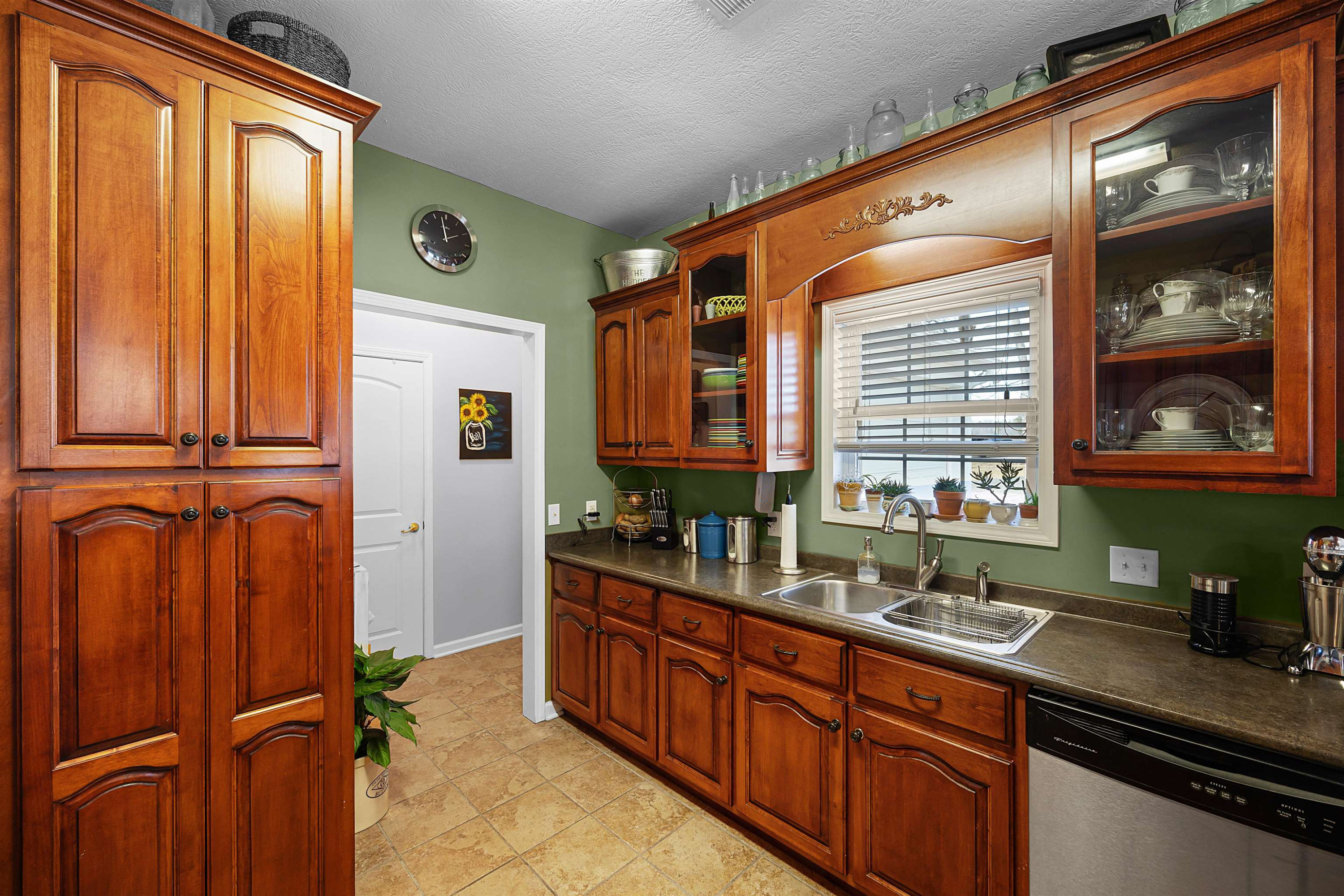 2305 Mockingbird Road Medon, TN 38356 - Photo 22 of 27 a bathroom with a sink a mirror and next to a window