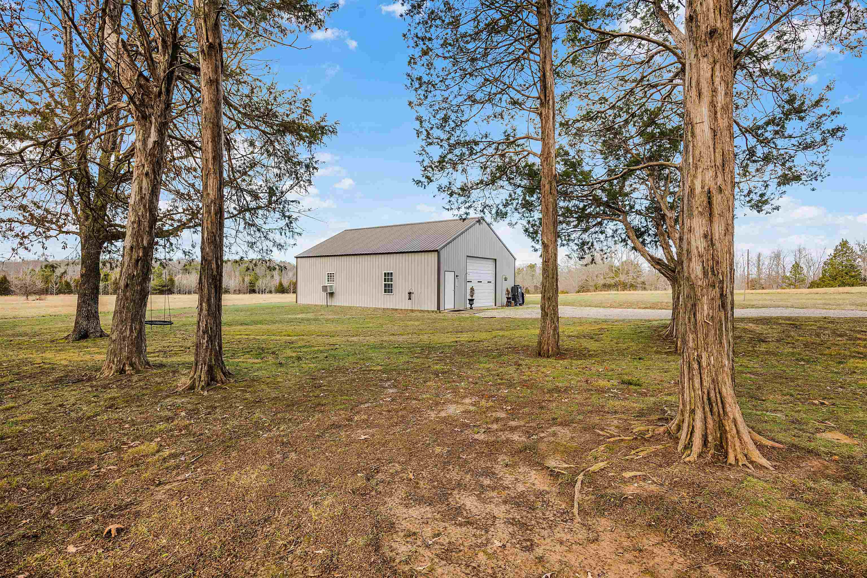 2305 Mockingbird Road Medon, TN 38356 - Photo 23 of 27 a house with trees in front of it
