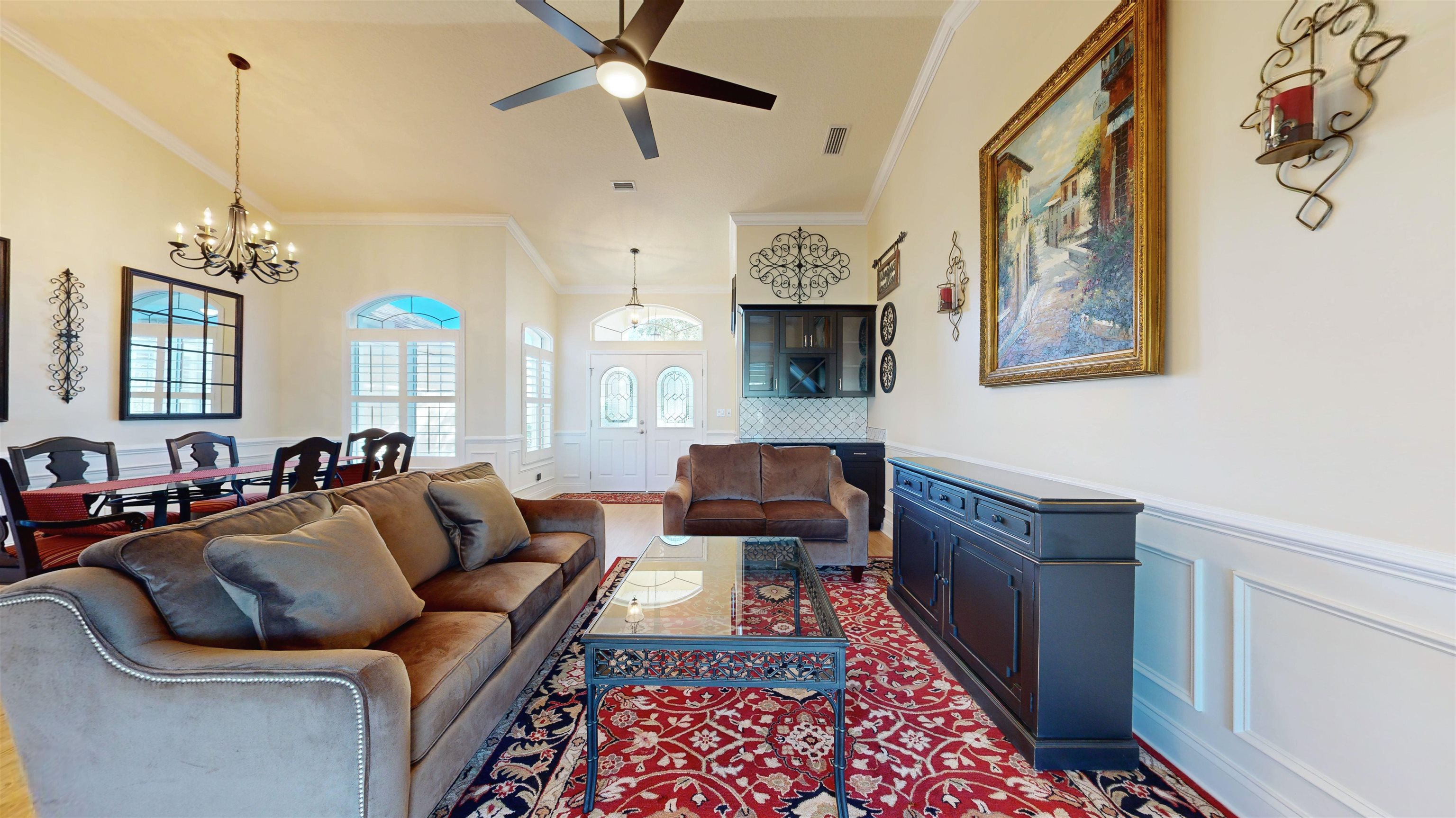 337 San Nicolas Way St. Augustine, FL 32080 - Photo 6 of 23 a living room with furniture and a chandelier