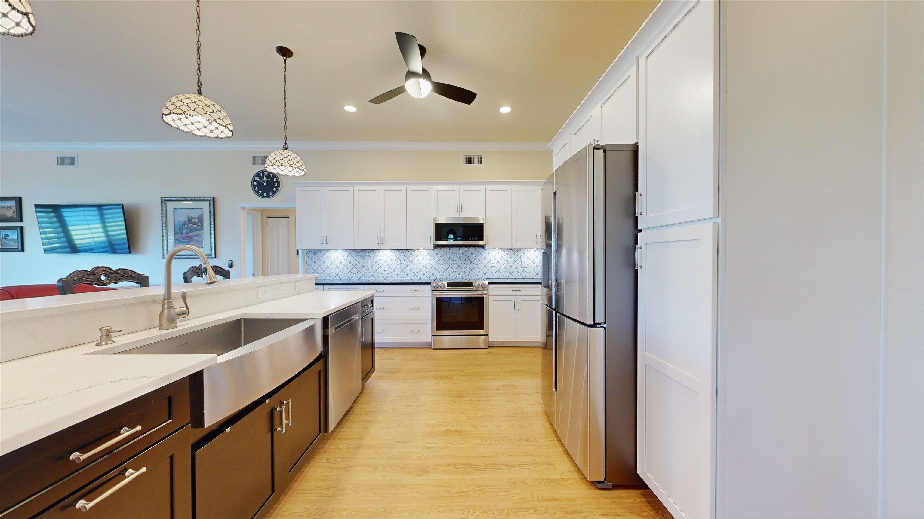 337 San Nicolas Way St. Augustine, FL 32080 - Photo 9 of 23 a large kitchen with a large counter top cabinets a sink and stainless steel appliances