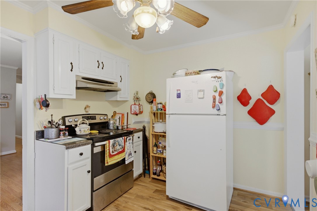 4175 Cedar Plains Road Sandy Hook, VA 23153 - Photo 10 of 31 Kitchen featuring white cabinetry, wood-finish flo
