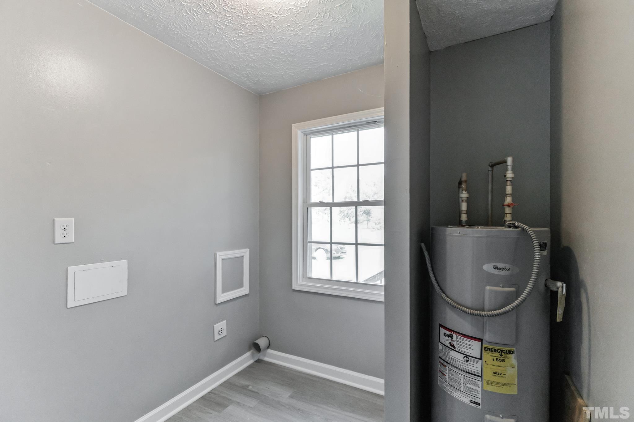 3763 Waycross Road Magnolia, NC 28453 - Photo 18 of 34 a room with water heater and a window