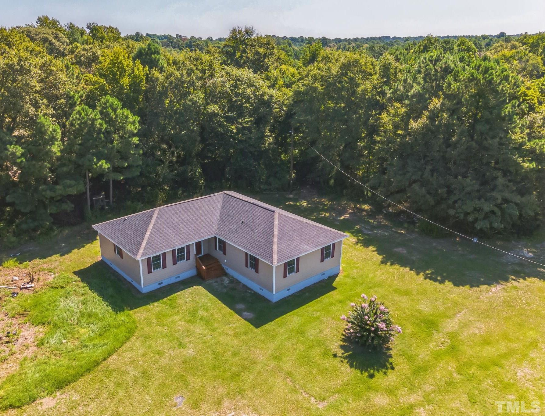 3763 Waycross Road Magnolia, NC 28453 - Photo 2 of 34 a aerial view of a house with swimming pool and large trees