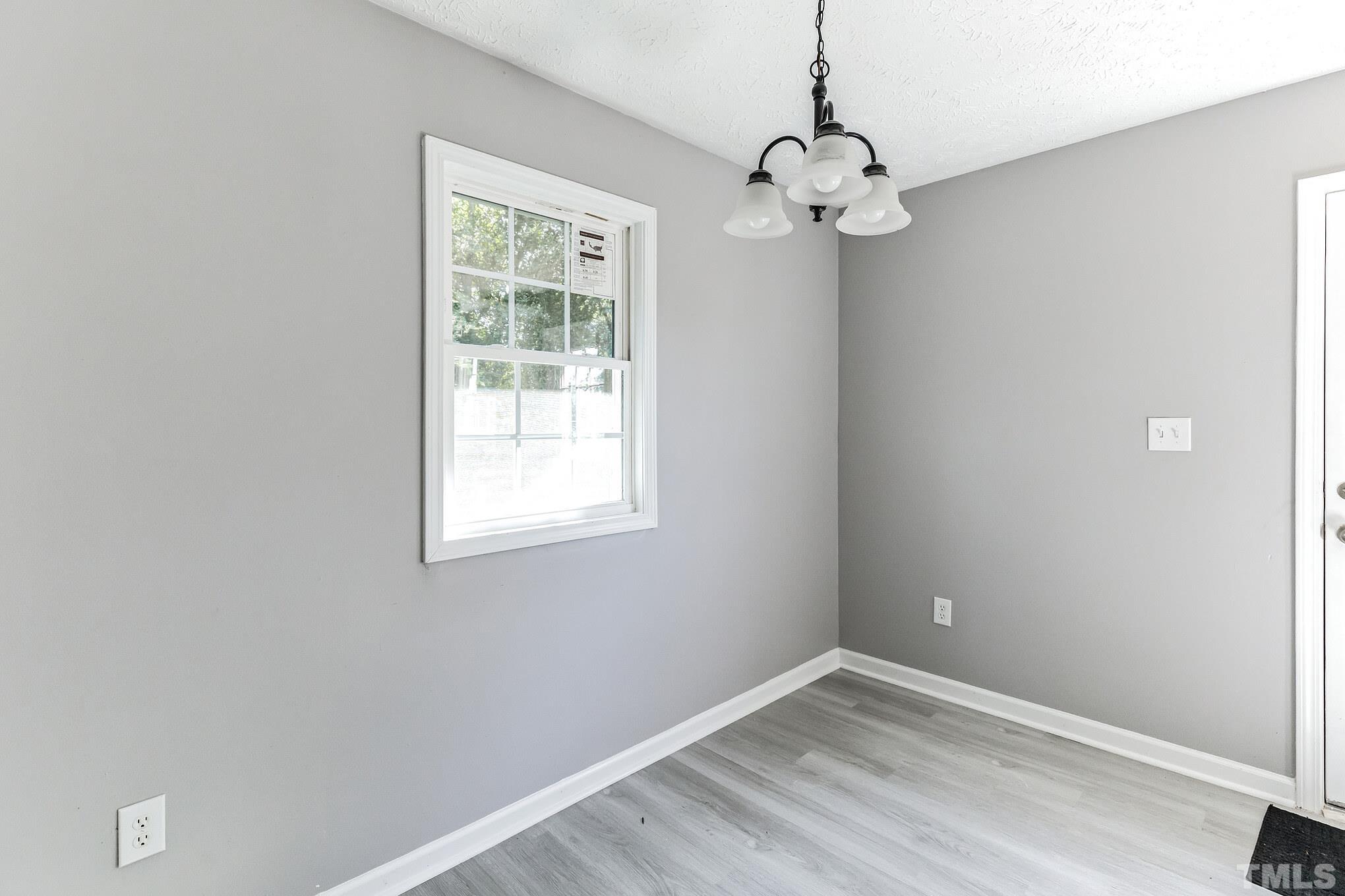 3763 Waycross Road Magnolia, NC 28453 - Photo 21 of 34 a view of a chandelier in a room