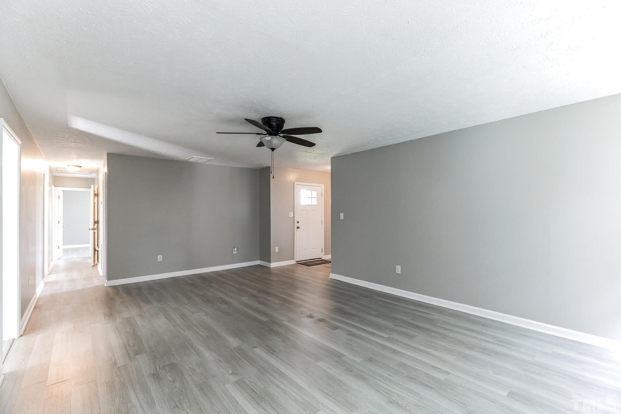 3763 Waycross Road Magnolia, NC 28453 - Photo 22 of 34 a view of an empty room with wooden floor