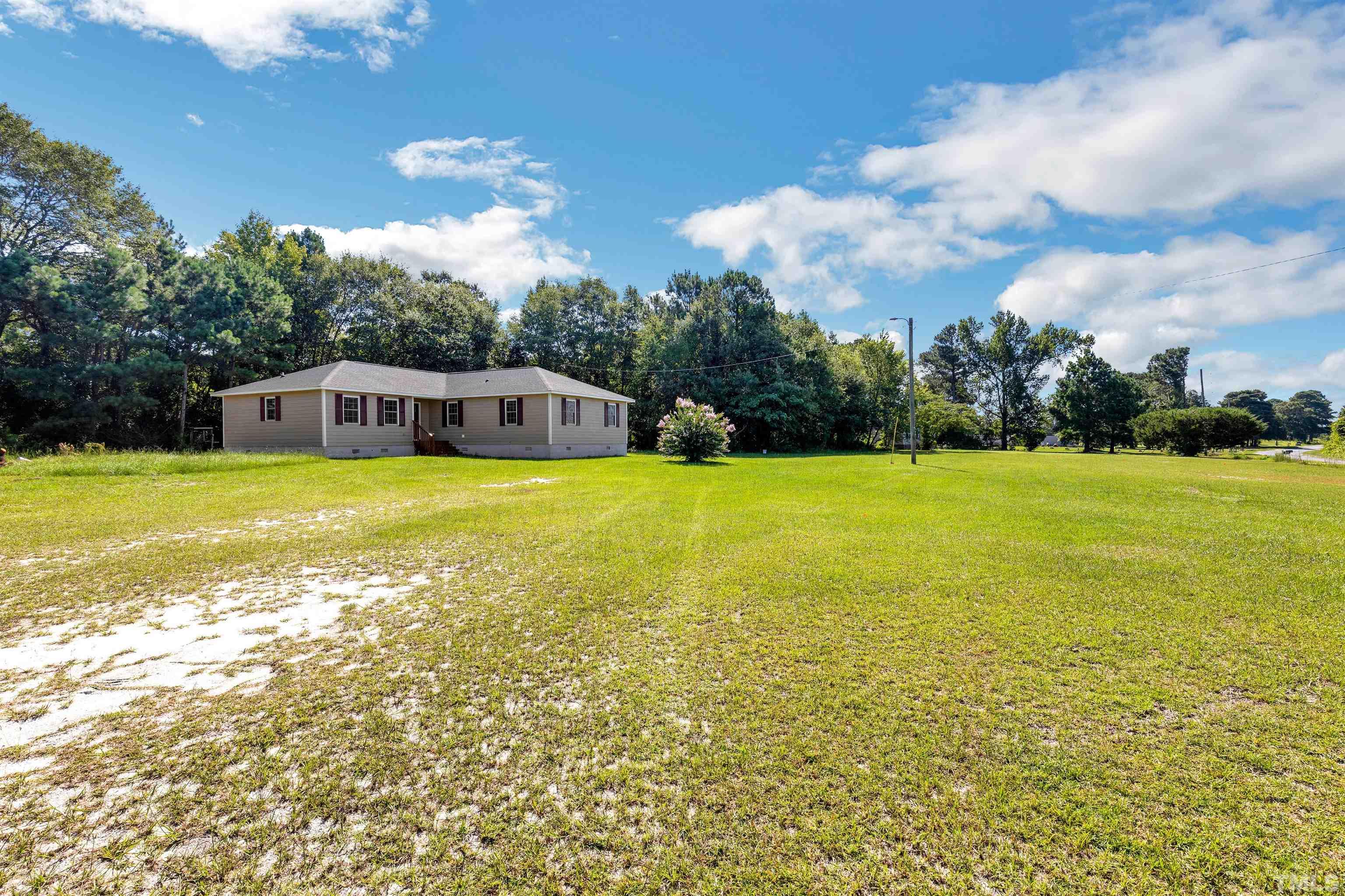 3763 Waycross Road Magnolia, NC 28453 - Photo 25 of 34 a view of a swimming pool with an ocean view