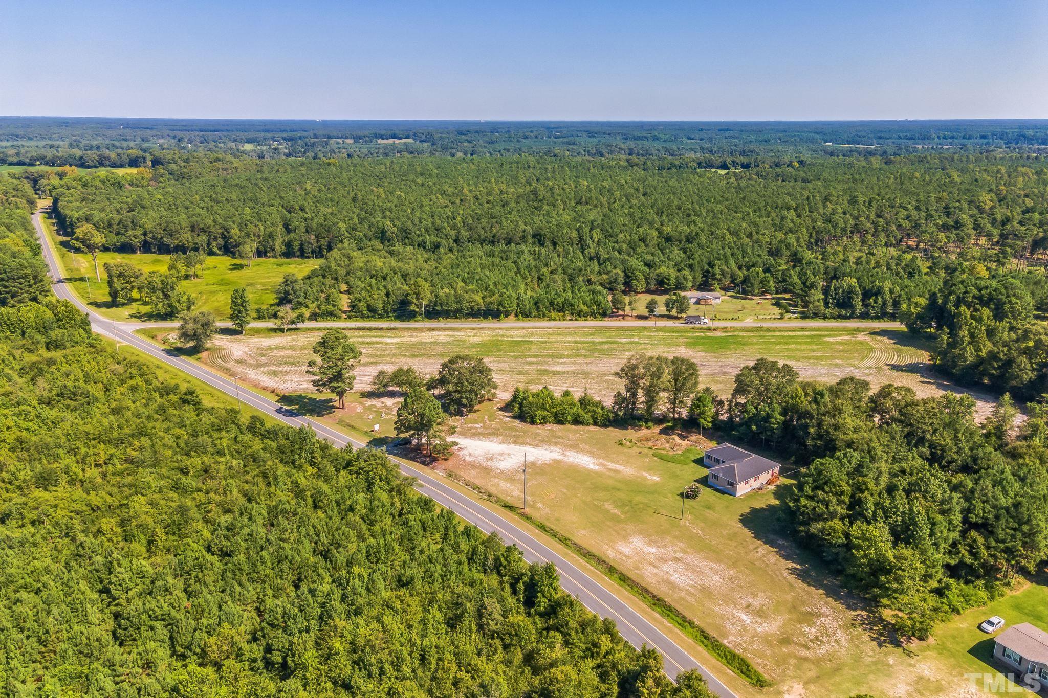 3763 Waycross Road Magnolia, NC 28453 - Photo 32 of 34 a view of a lake with a houses