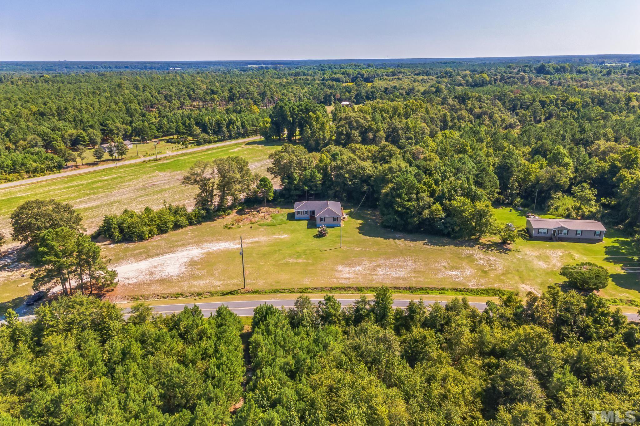 3763 Waycross Road Magnolia, NC 28453 - Photo 33 of 34 a view of a swimming pool with an outdoor space and seating area