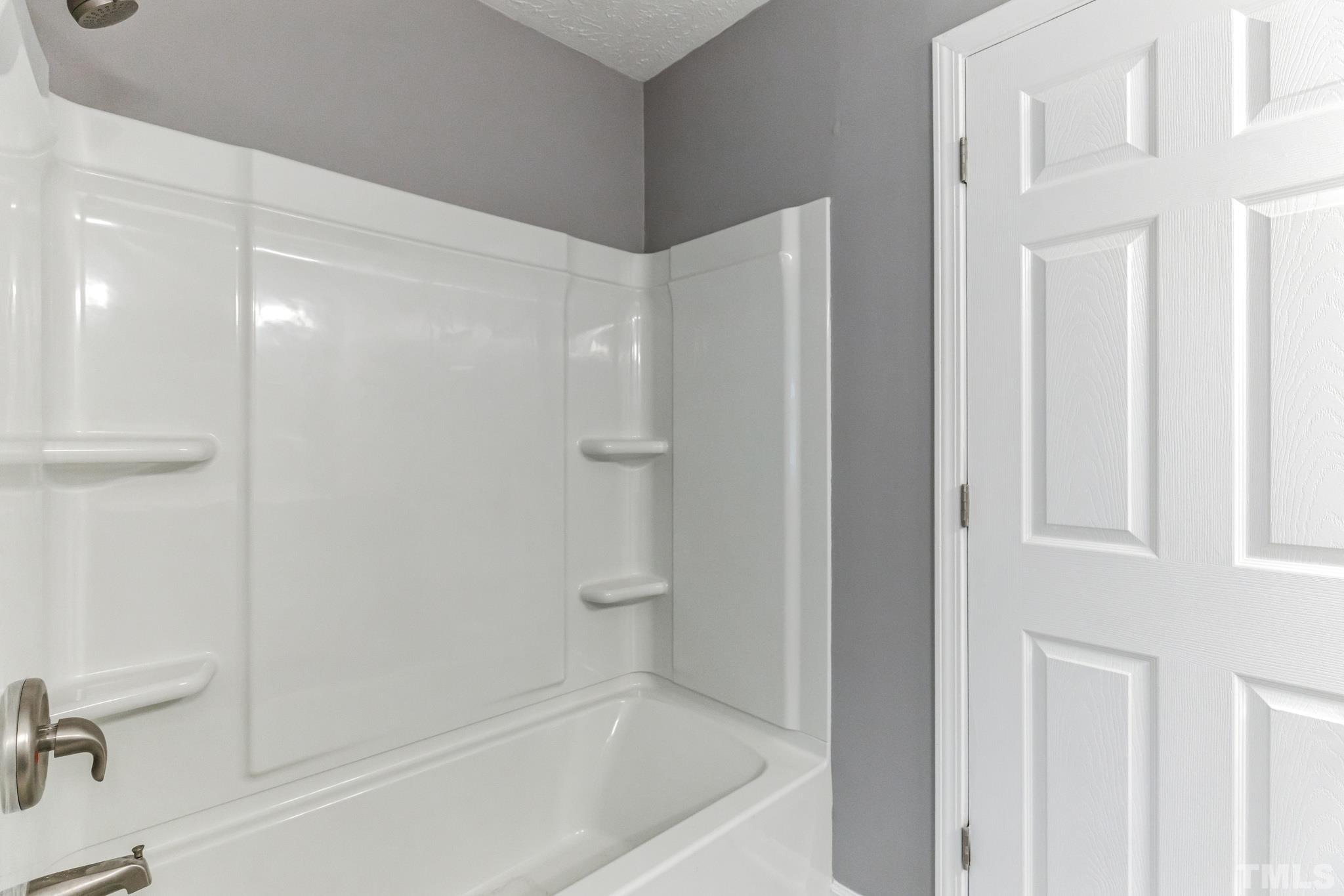 3763 Waycross Road Magnolia, NC 28453 - Photo 4 of 34 a bathroom with a bathtub