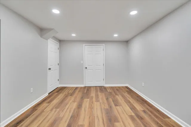 a backyard of a house with lots of green space and fountain