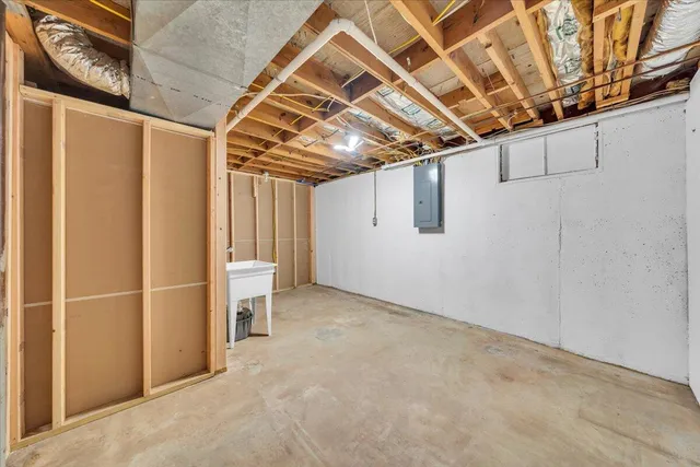 a view of a house with a yard and tree