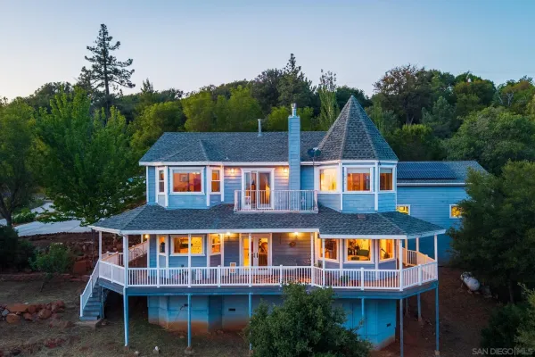 a aerial view of residential houses with yard and swimming pool