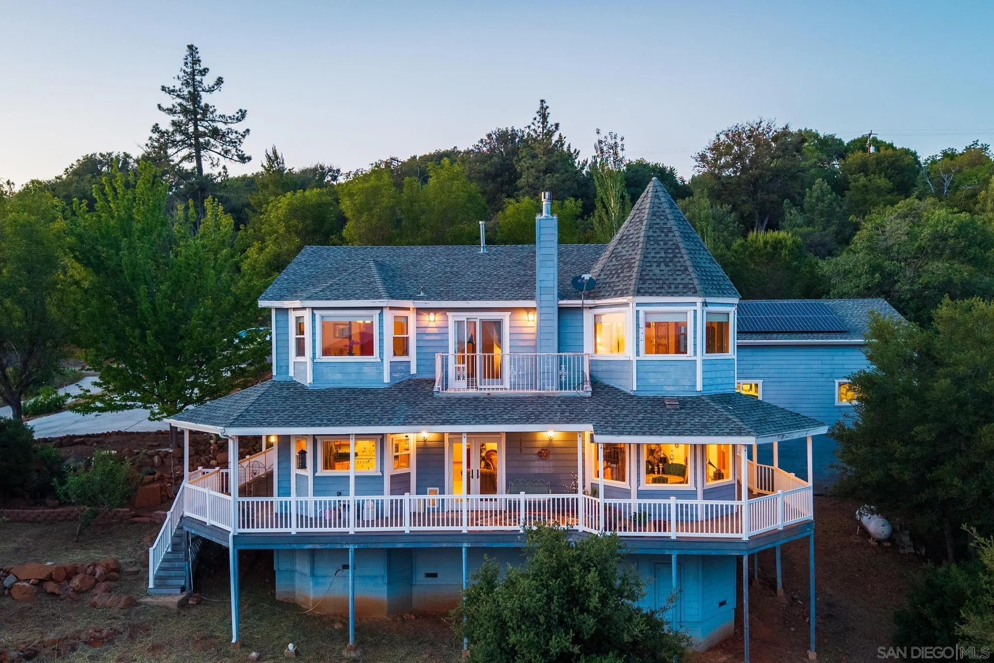 a aerial view of residential houses with yard and swimming pool