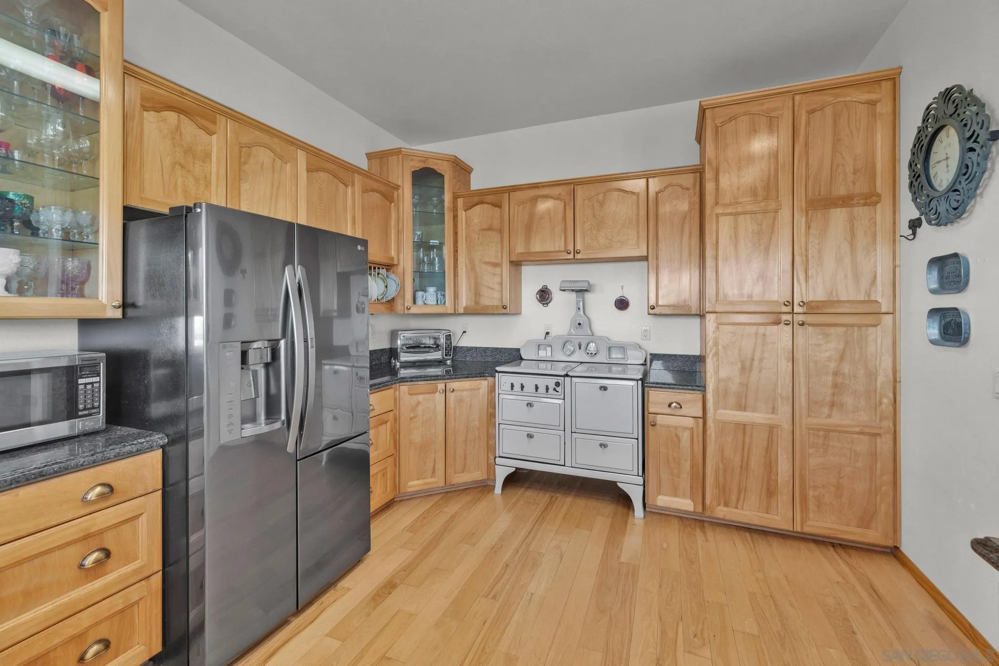 4819 Pine Ridge Avenue Julian, CA 92036 - Photo 14 of 51 a kitchen with stainless steel appliances a refrigerator sink and cabinets