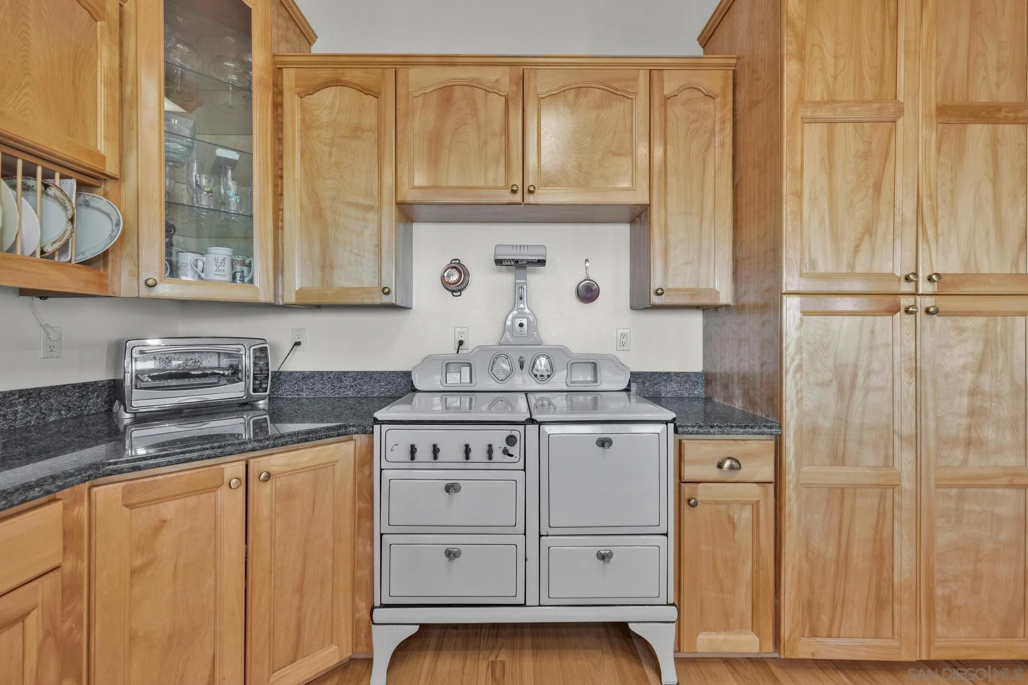 4819 Pine Ridge Avenue Julian, CA 92036 - Photo 15 of 51 a bathroom with a granite countertop sink and a mirror