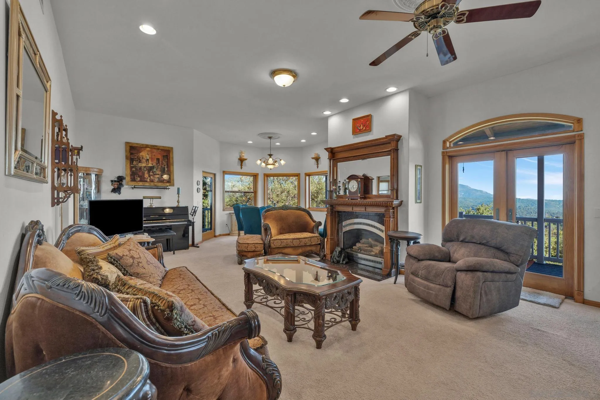 4819 Pine Ridge Avenue Julian, CA 92036 - Photo 17 of 51 a living room with furniture a flat screen tv and a fireplace
