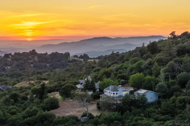 an aerial view of residential houses and outdoor space
