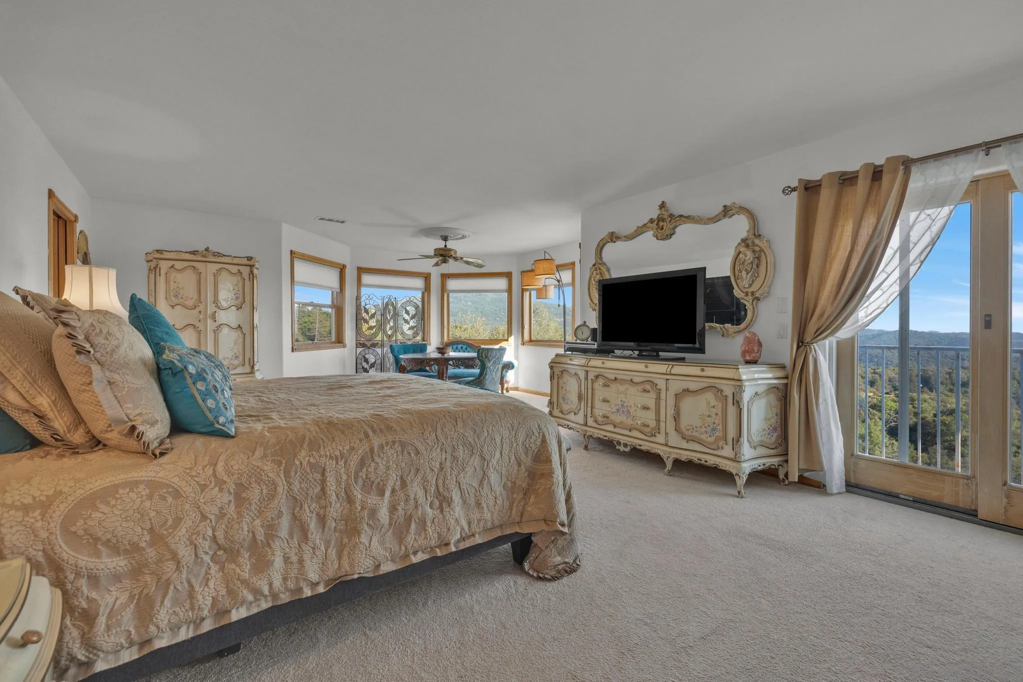 4819 Pine Ridge Avenue Julian, CA 92036 - Photo 26 of 51 a spacious bedroom with a bed and a flat screen tv