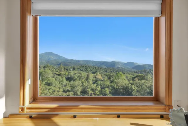 a view of a glass door and a window