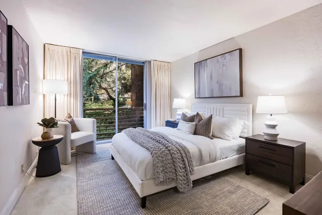 a bedroom with a bed and a couch