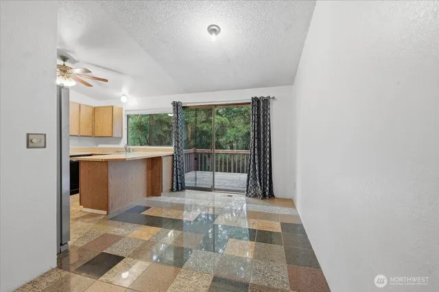 a view of a kitchen with a sink and a window