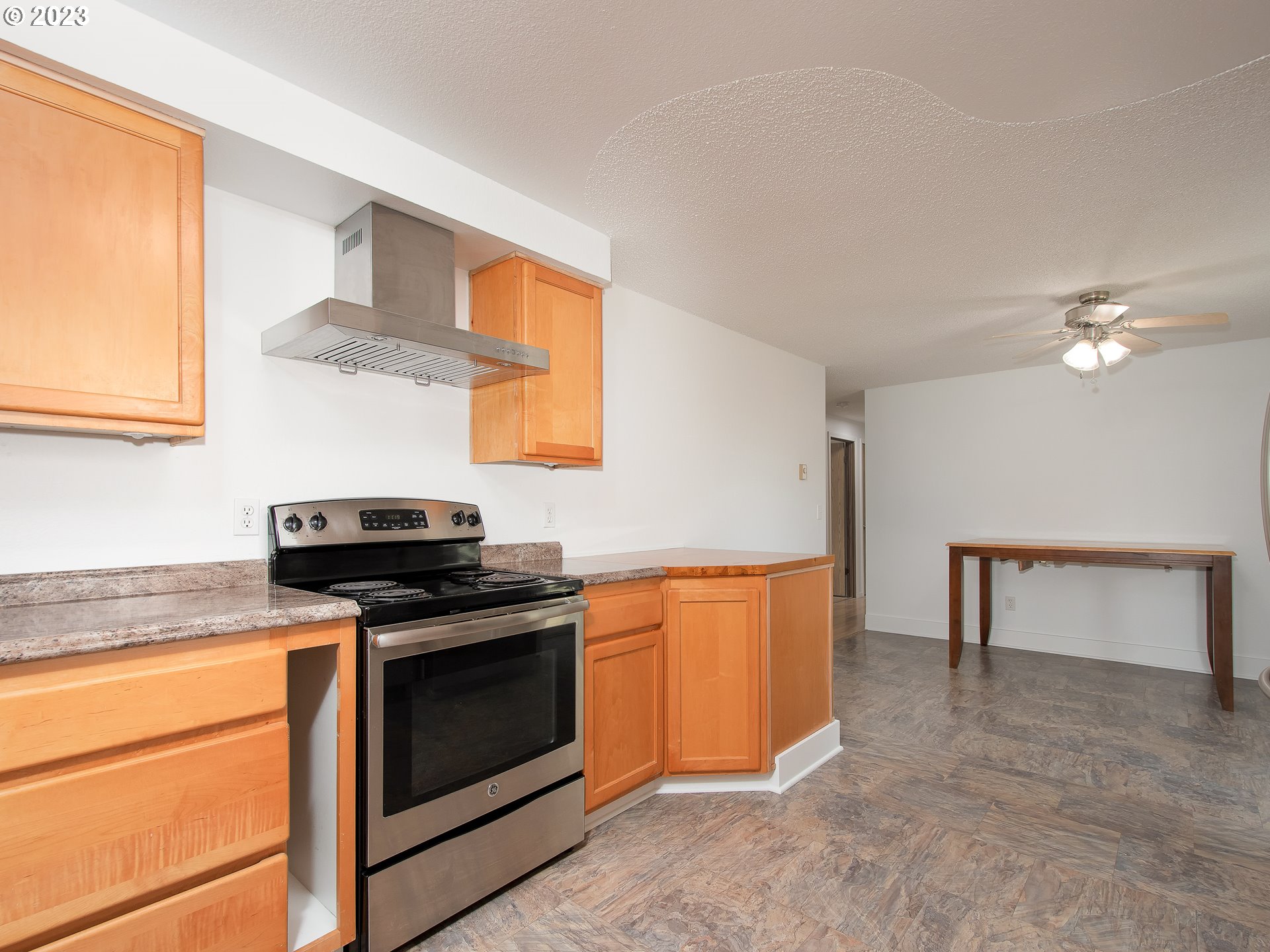 5208 Northeast 139th Loop Vancouver, WA 98682 - Photo 19 of 37 a kitchen with stainless steel appliances granite countertop a stove a sink and a refrigerator