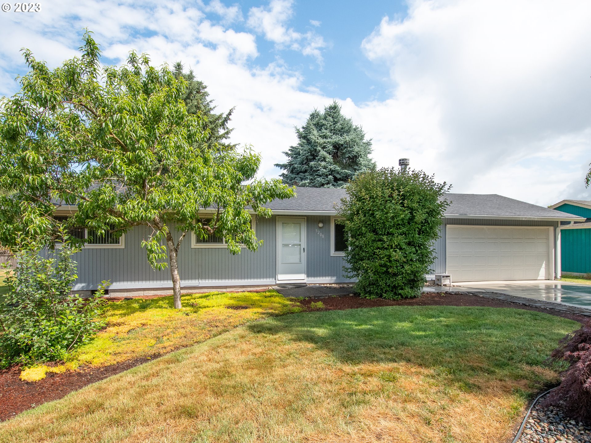 5208 Northeast 139th Loop Vancouver, WA 98682 - Photo 2 of 37 a view of a house with a yard and tree s