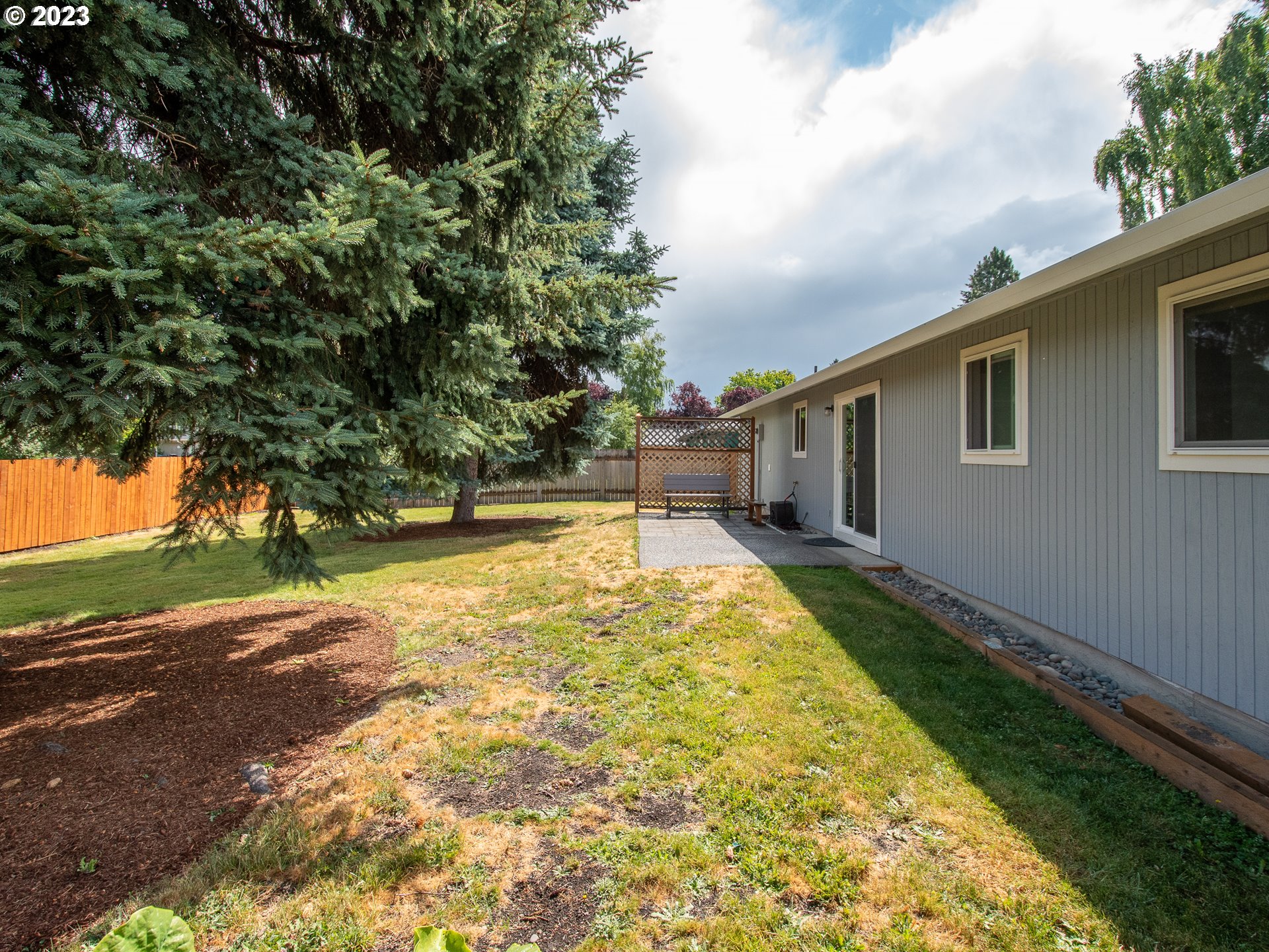 5208 Northeast 139th Loop Vancouver, WA 98682 - Photo 26 of 37 a view of a house with backyard and tree