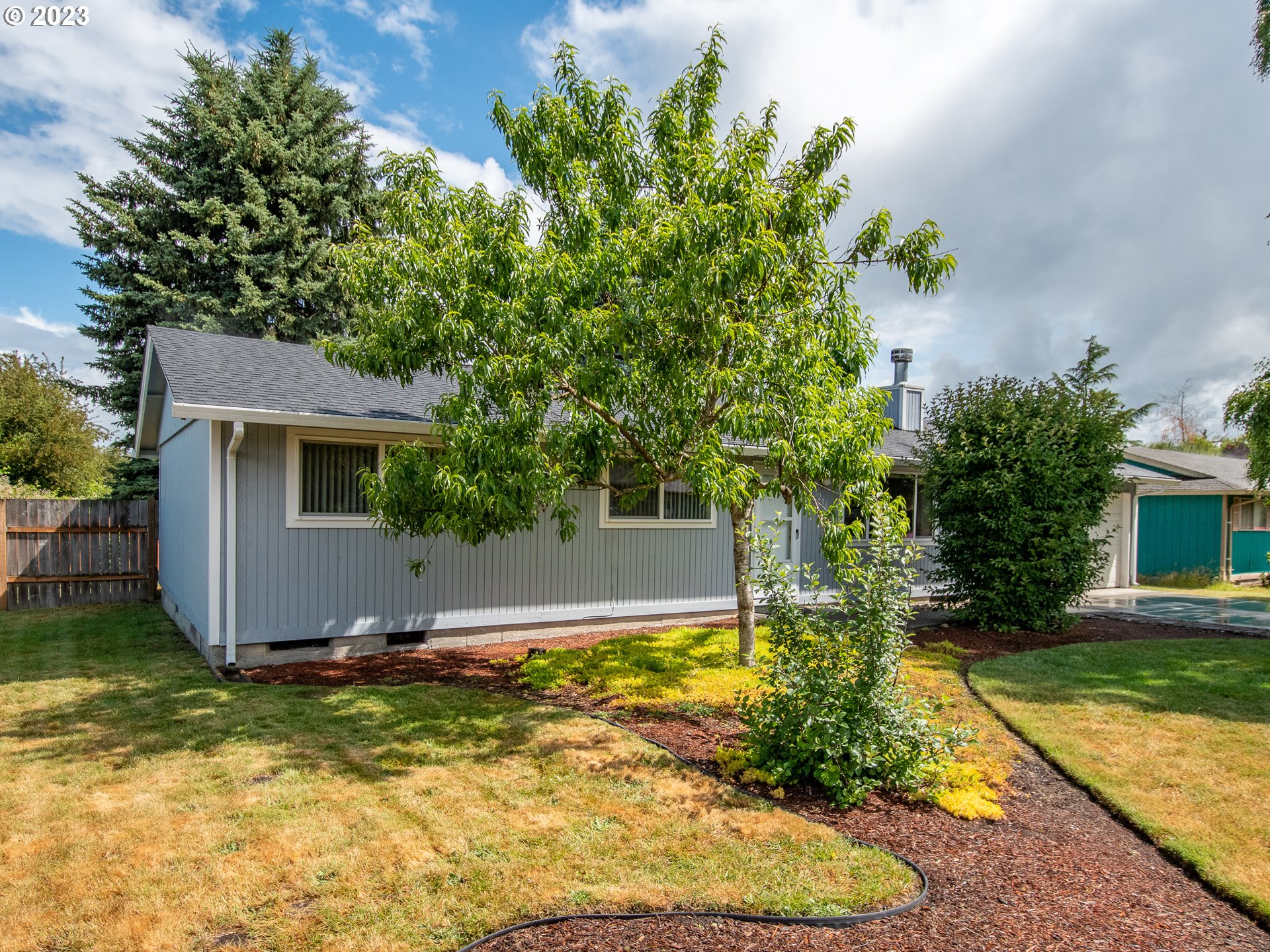 5208 Northeast 139th Loop Vancouver, WA 98682 - Photo 3 of 37 a view of a house with a yard and potted plants