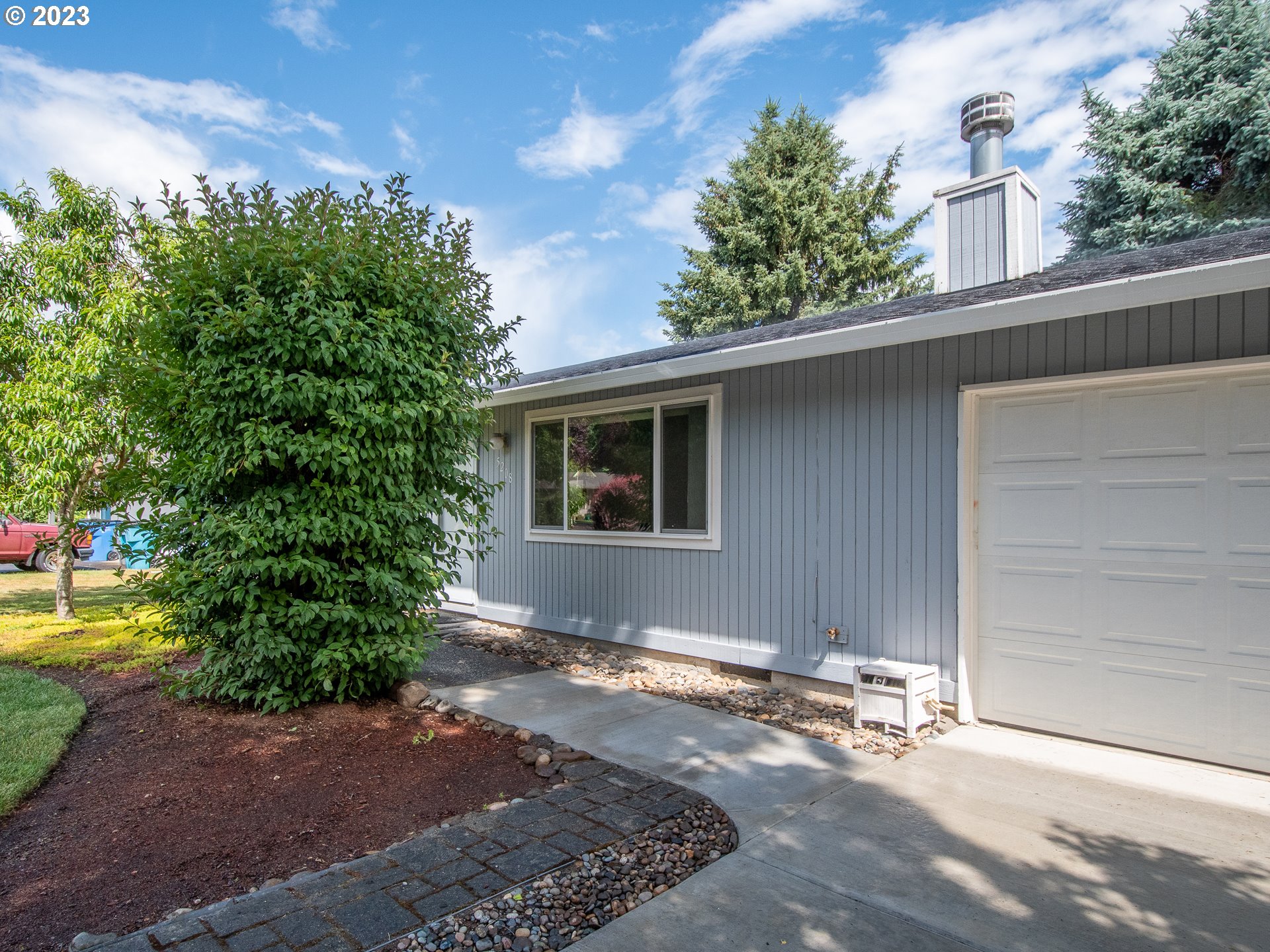 5208 Northeast 139th Loop Vancouver, WA 98682 - Photo 33 of 37 a house with a tree in front of it
