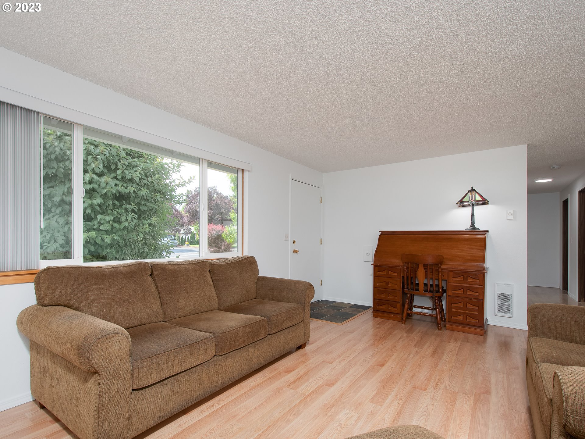 5208 Northeast 139th Loop Vancouver, WA 98682 - Photo 8 of 37 a living room with furniture and a wooden floor