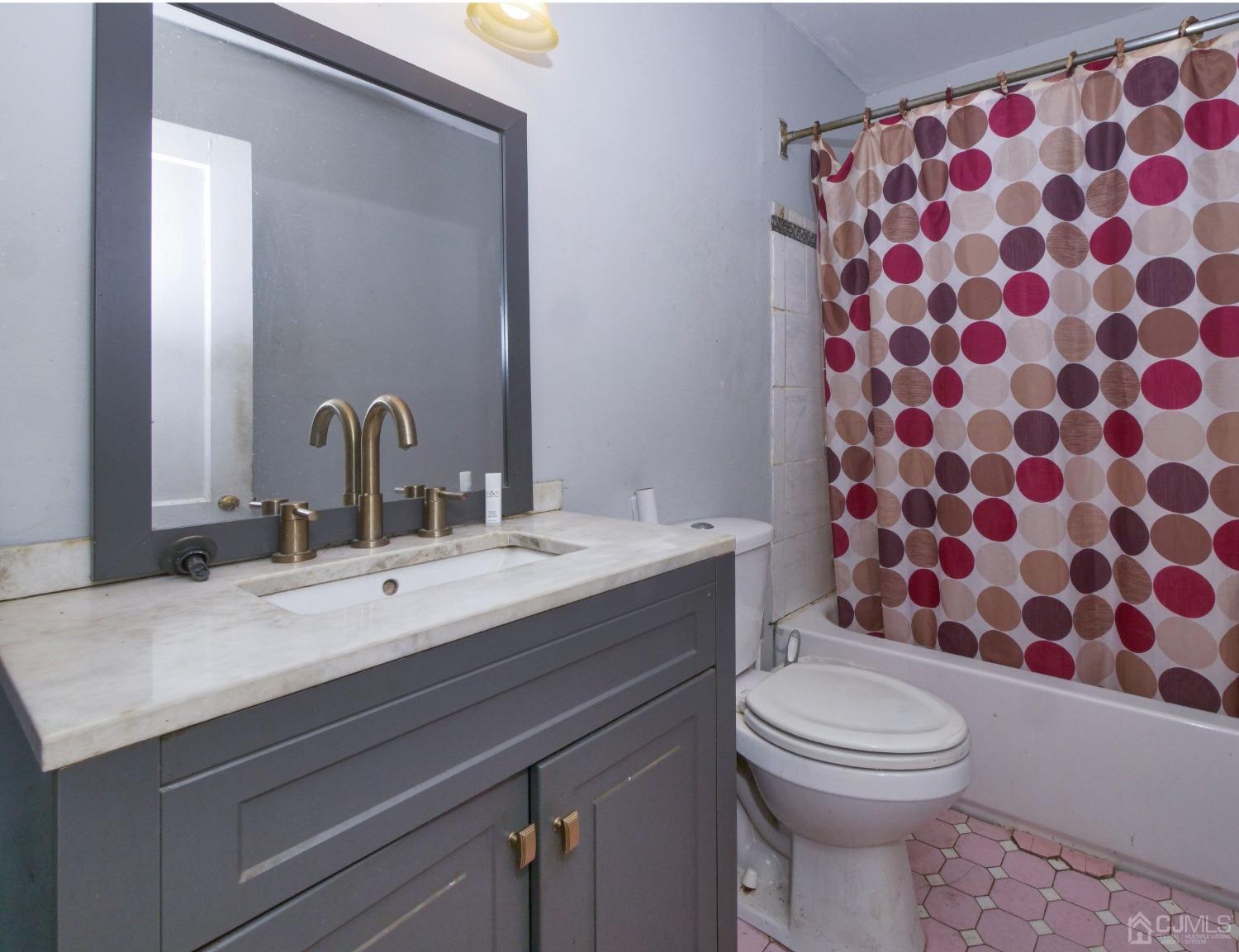 124 Half Acre Road Monroe Township, NJ 08831 - Photo 11 of 12 a bathroom with a sink toilet and shower