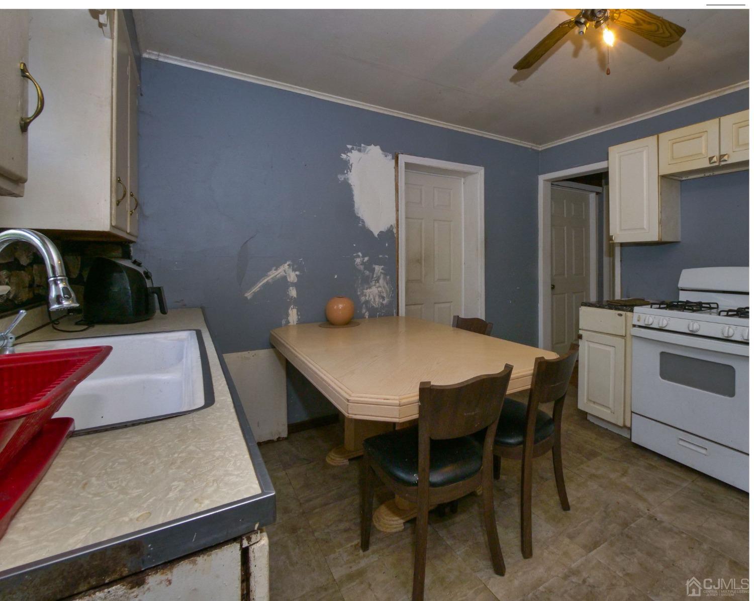 124 Half Acre Road Monroe Township, NJ 08831 - Photo 4 of 12 a view of a dining room with furniture