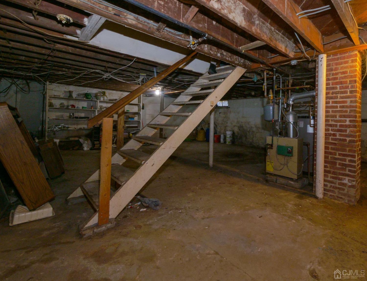 124 Half Acre Road Monroe Township, NJ 08831 - Photo 6 of 12 a view of an empty room with wooden stairs