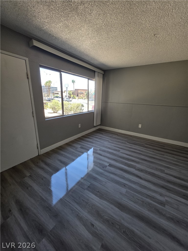 1089 East Desert Inn Road, Unit 3 Las Vegas, NV 89109 - Photo 4 of 15 The sun-drenched flooring adds warmth and texture to this versatile interior space.