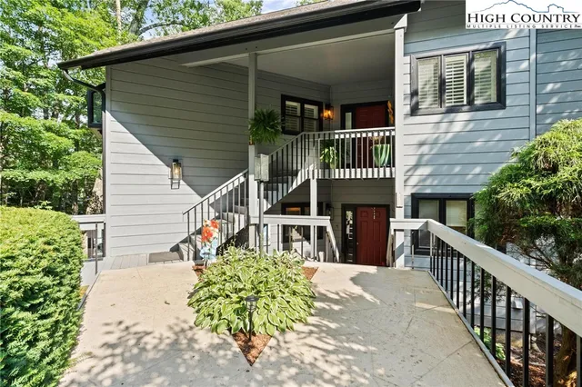 a living room with furniture flat screen tv and a fireplace