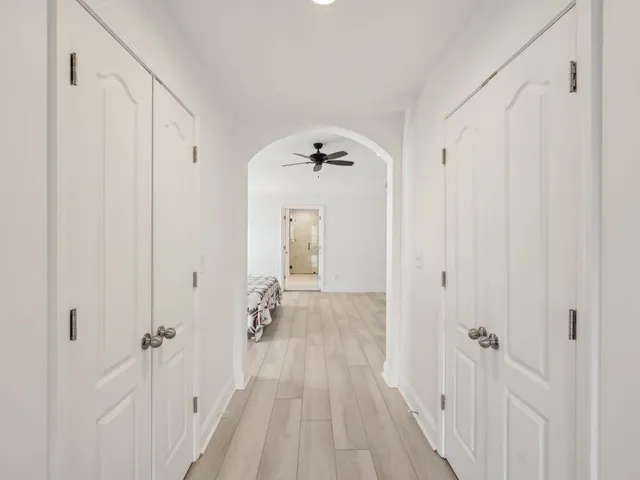 a view of walk in closet with clothes