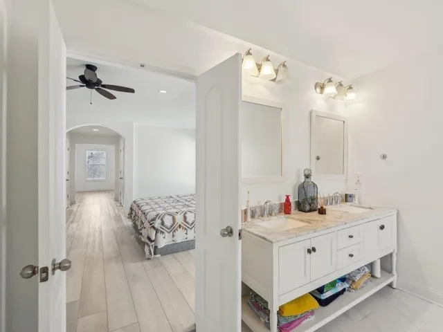 a bathroom with a bathtub and a shower