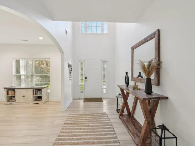 a view of a livingroom with furniture and staircase