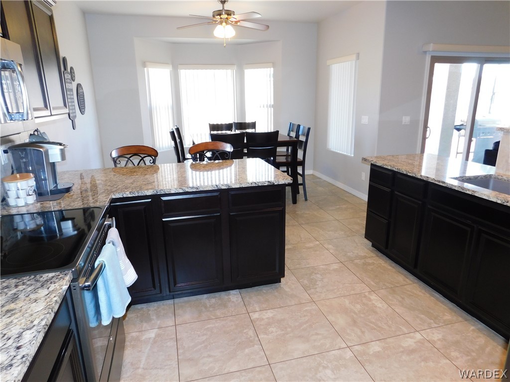 3370 South Ridge Avenue Bullhead City, AZ 86429 - Photo 33 of 56 a kitchen with a sink counter top space and cabinets