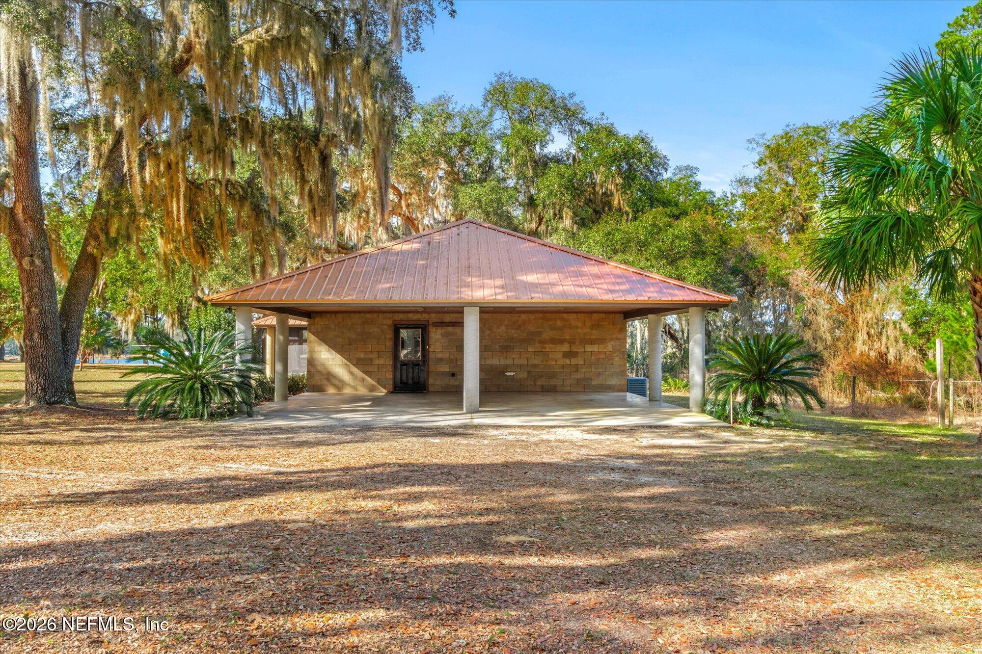 118 Hooks Lake Road Melrose, FL 32666 - Photo 11 of 61 a view of a house with a yard