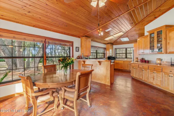 a open kitchen with stainless steel appliances granite countertop a stove and cabinets